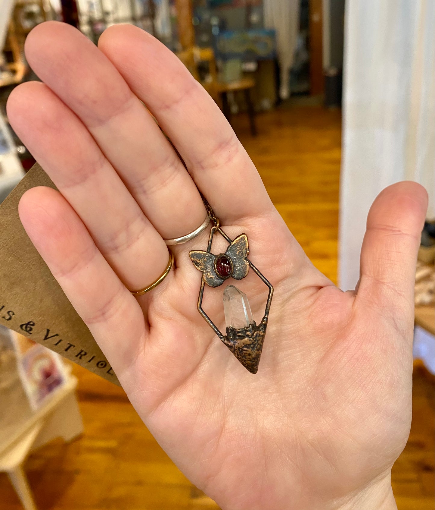 Quartz Framed Pendant with Butterfly and Garnet